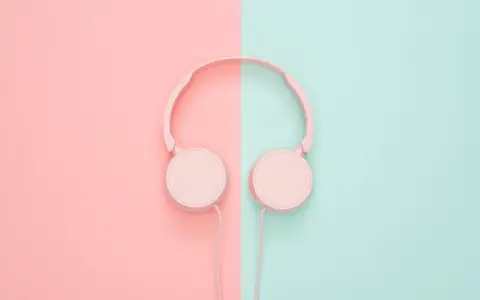 Representative photo: Plain pink on-ear headphones on a pastel background. Not the exact product; the deal link goes to the actual product.