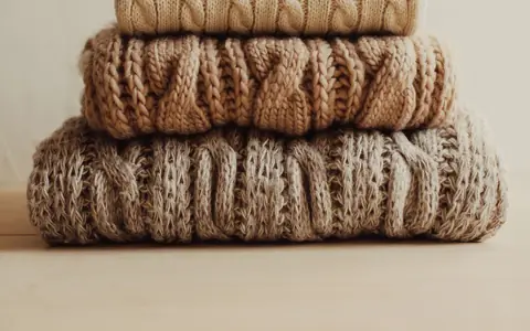 Representative photo: Stack of folded knit sweaters. Not the exact product; the deal link goes to the actual product.